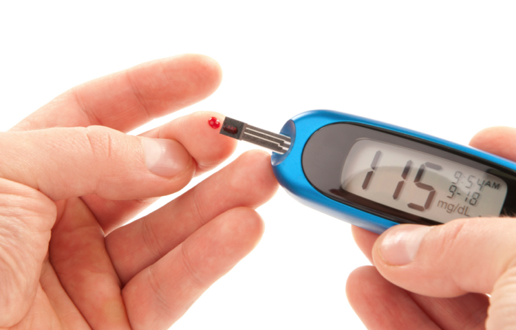 A person pricks their finger for a blood sugar test