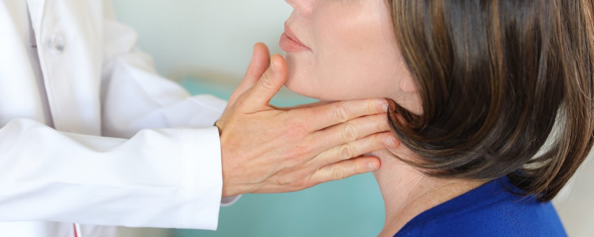 A woman being examined by a doctor.