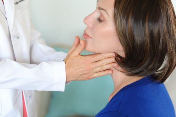 A woman being examined by a doctor.